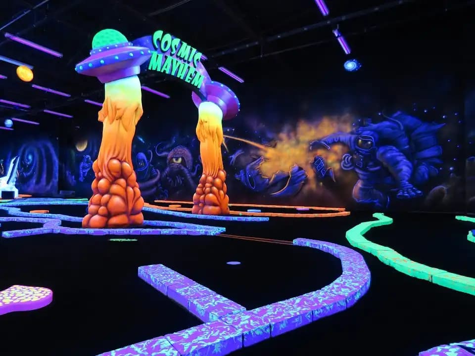 axe throwing experience at Cosmic Mayhem: Black Light Mini Golf and Bar located in San Antonio