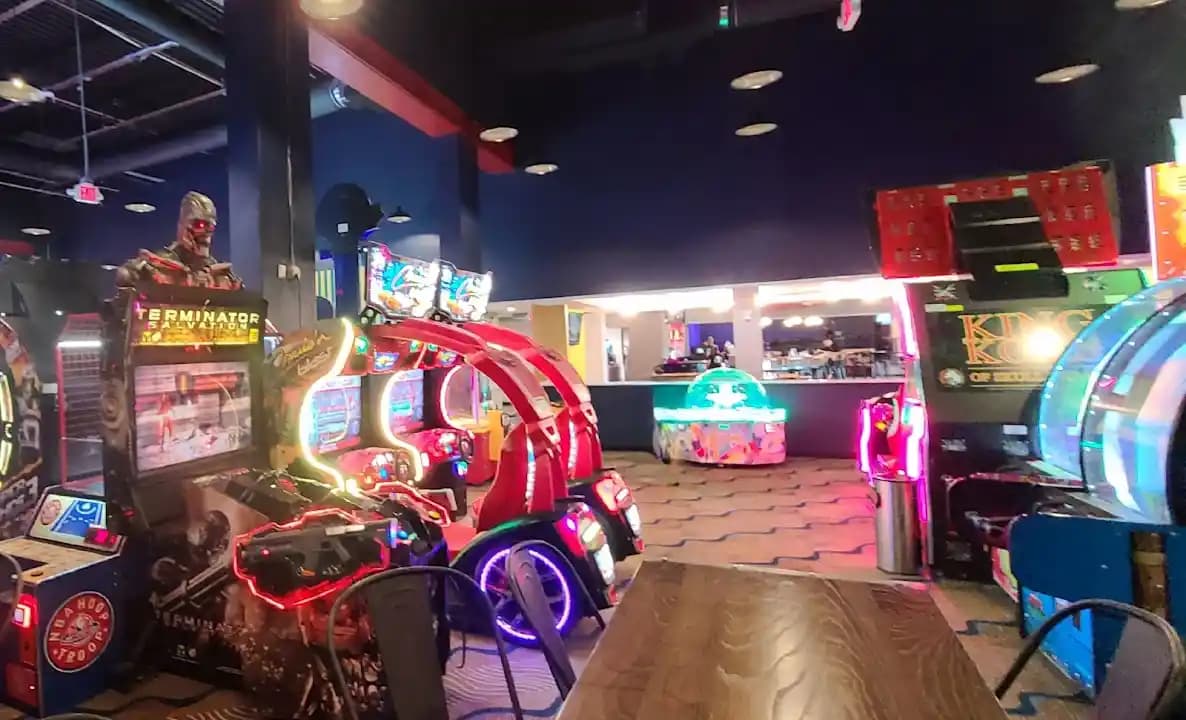 Interior view of 1UP Entertainment + Social axe throwing facility in Tampa